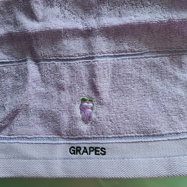Asciugamano viola uva